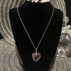 See through grey glass heart pendant on an 18 inch length necklace